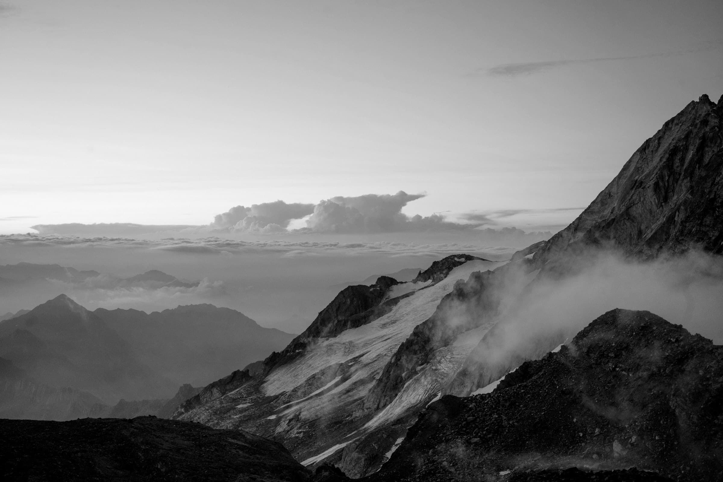 A darkened massif under heavy cloud