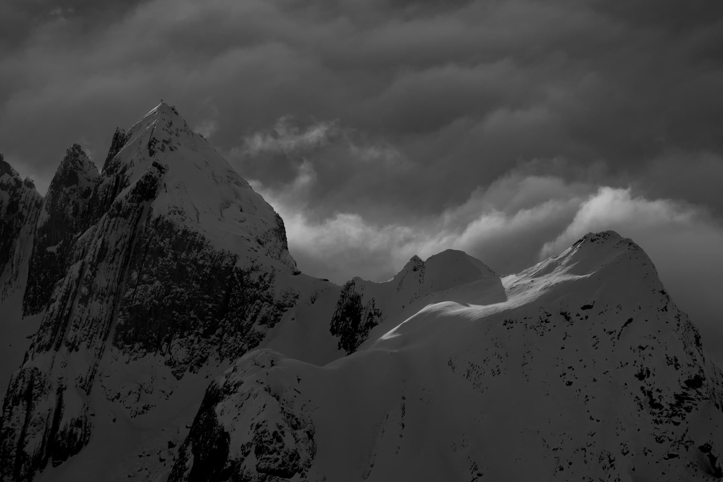 A storm-shrouded peak at dusk
